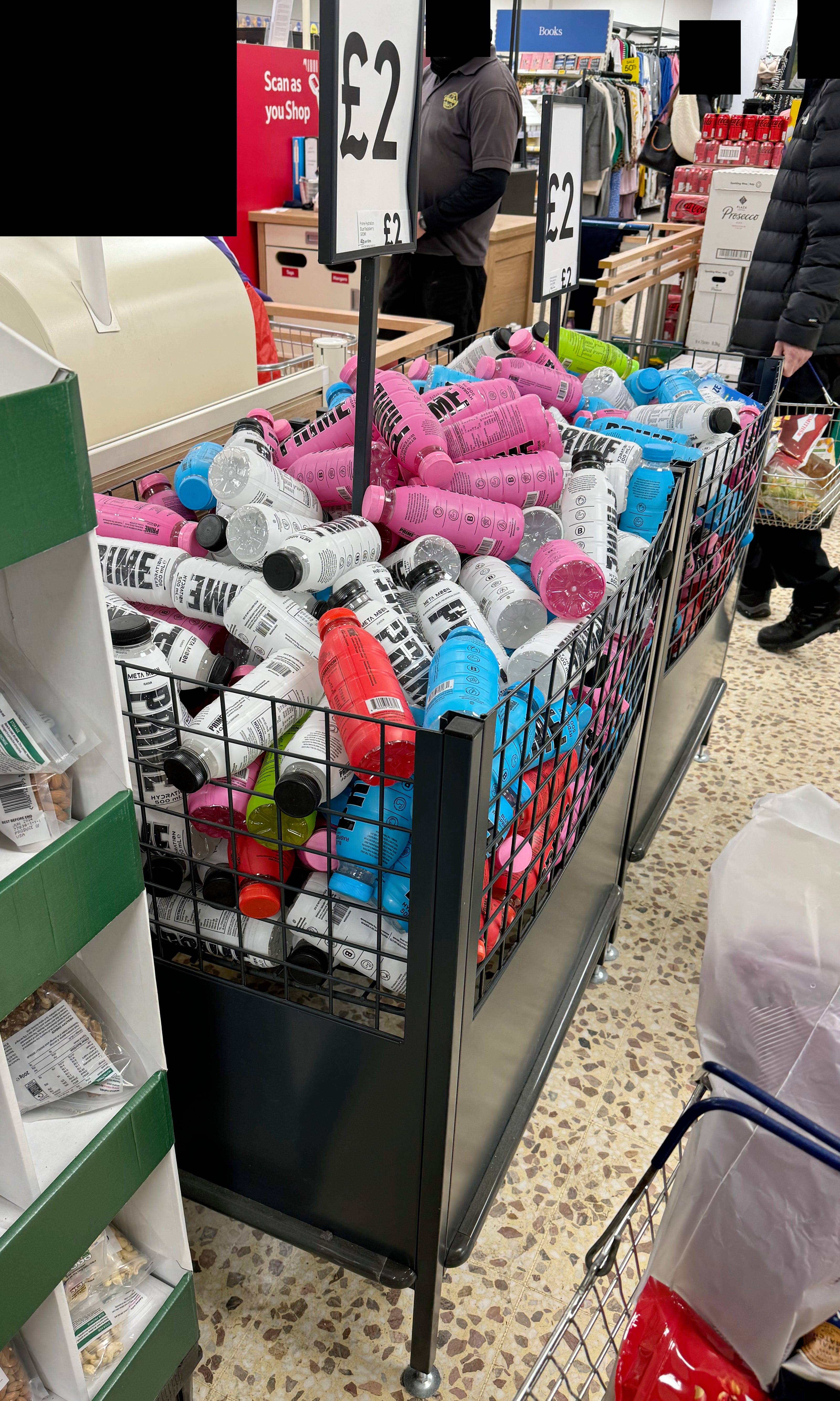 Picture of an overflowing bin containing PRIME Hydration drinks, taken within a Tesco (2023, Internet Talk)